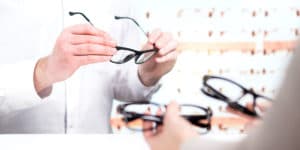 A patient looks at glasses options